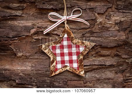 christmas decoratons with baubles on wooden background