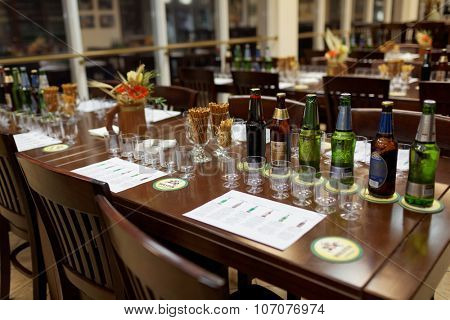 ST. PETERSBURG, RUSSIA - OCTOBER 24, 2015: Beer bottles at the table during tasting session in the Baltika - St Petersburg brewery. This session is a part of the October Beer Festival celebrations