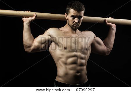 Muscular Man With Crossbar
