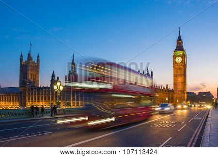 Iconic Double Decker bus with Big Ben and Parliament at blue hour, London, UK