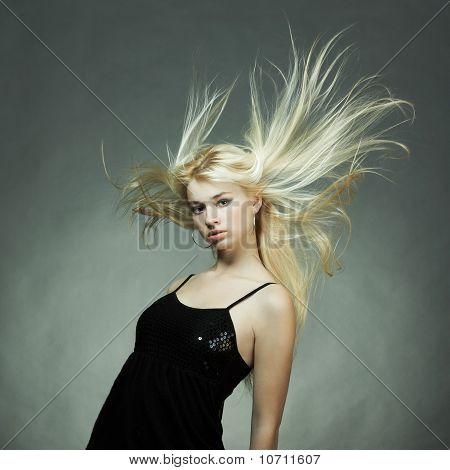 Fashion Portrait Of The Young Blonde Woman