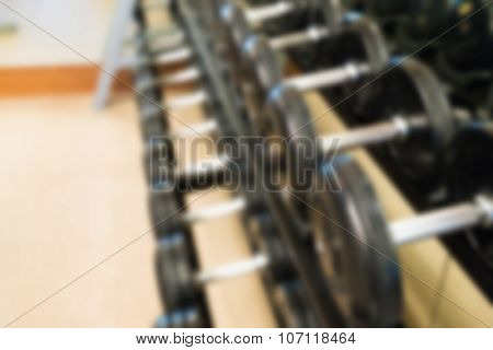 Abstract blur Fitness center with traineger equipments
