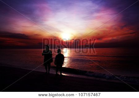 The silhouette of a people walking on the beach at sunset. ,at  international beach of thailand