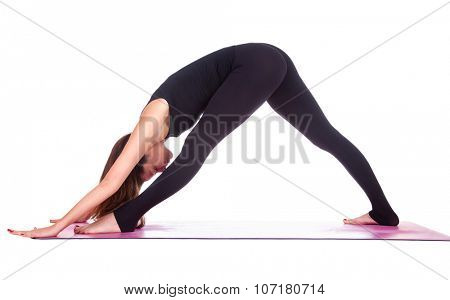 Beautiful woman doing Parsvottanasana pose on yoga class, Studio shot.