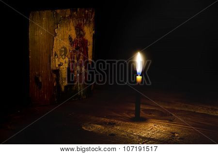 Ancient Icon Illuminated By Candle Light.