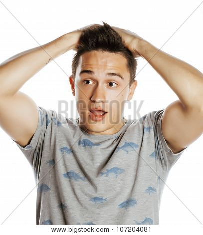 young attractive man isolated thinking emotional on white close up gesturing