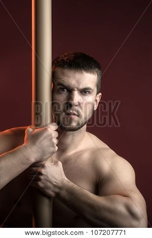 Muscular Man With Crossbar