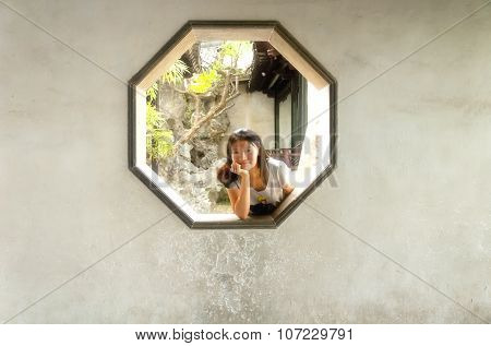 Chinese Woman In Octagon Window