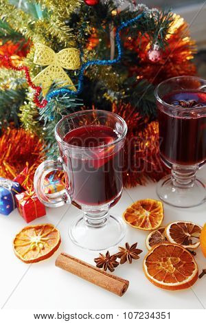 mulled wine with decorated christmas tree