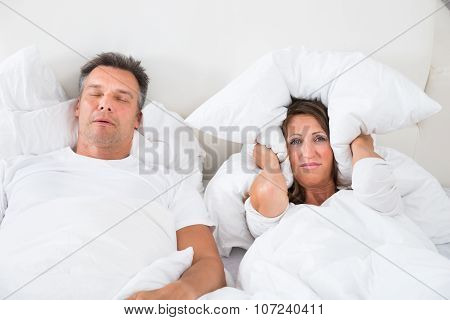 Angry Woman Trying To Sleep With Snoring Man