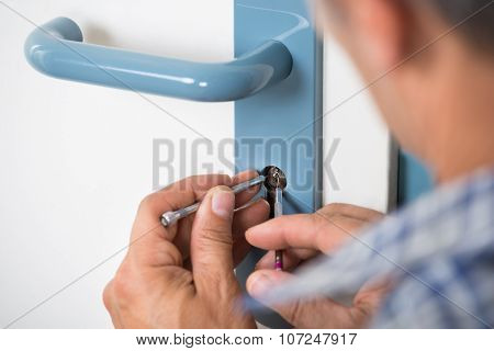 Lockpicker Fixing Door Handle At Home