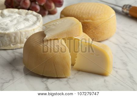  French cheese platter with camembert, chaussee aux moines and grapes as dessert