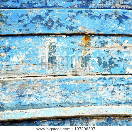 Stripped Paint In The Blue Wood Door And Rusty Nail