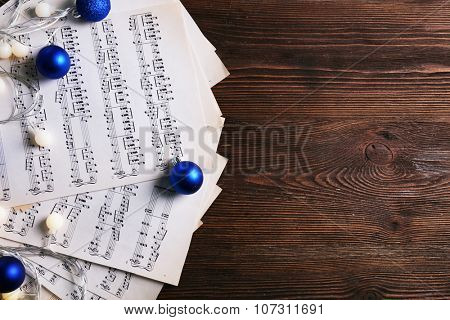 Music and Christmas decor on wooden table