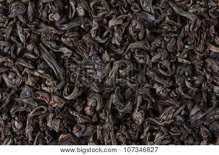 Black tea dry leaves. Macro, background