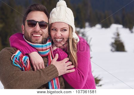 portrait of happy young romantic tourist  couple outdoor in nature at winter vacation