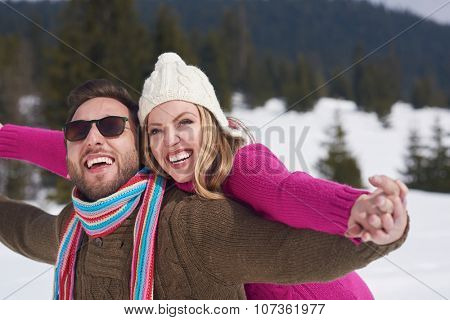 portrait of happy young romantic tourist  couple outdoor in nature at winter vacation