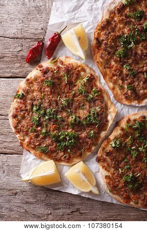 Asian Pizza Lahmacun Closeup On A Table. Vertical Top View