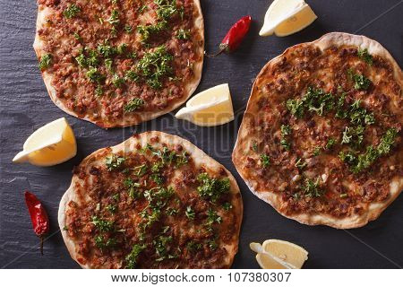 Turkish Pizza Lahmacun Closeup On A Stone Table. Horizontal Top View