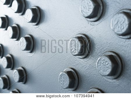 Gray Painted Metal Surface With Hexagonal Bolt Heads