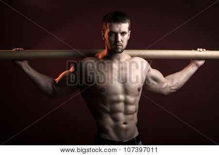 Muscular Man With Crossbar