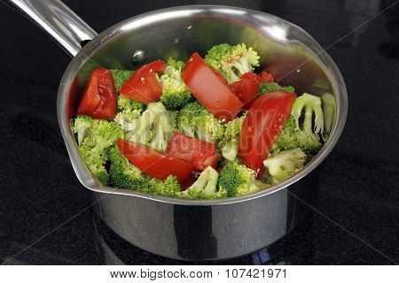 Raw Tomatoes And Broccoli In A Pan