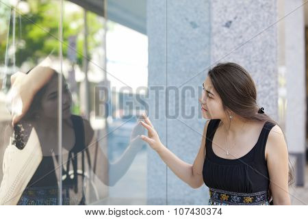 Biracial Teen Girl Window Shopping, Looking Into Store Front Glass