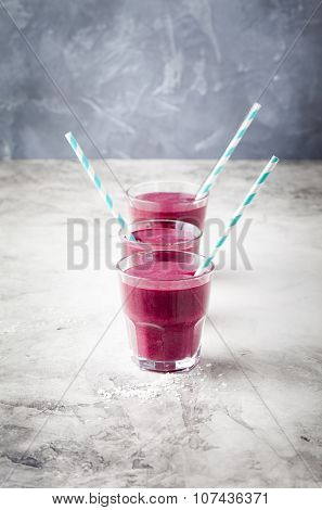 Blueberry, blackberry, honeysuckle, honeyberry smoothie with violet syrup and acai.