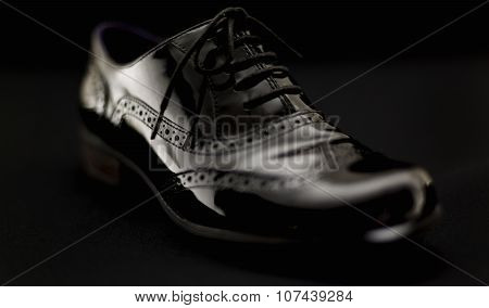 Footwear Concept. Horizontal Image. Pair Of Black Female Classic Leather Shoes On The Black Backgrou
