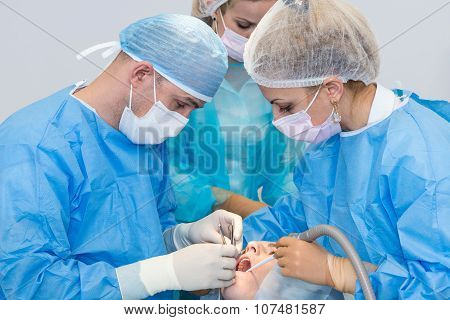 Dentists During Surgery For Implant Placement