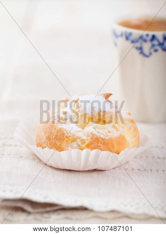 Profiteroles, choux with a custard cream. Dessert