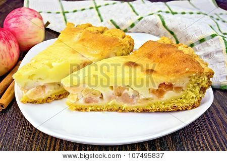 Pie apple with sour cream and cinnamon on dark board