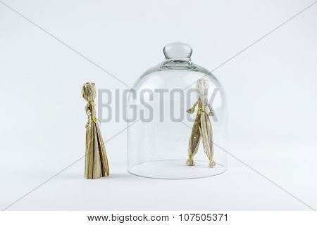 Man And Woman Straw Dolls, Separated By A Glass Bell