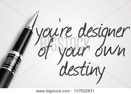 Pen Writes You're Designer Of Your Own Destiny On White Blank Paper