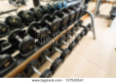 Abstract blur Fitness center with traineger equipments