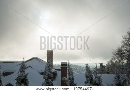 View Over Rooftops And Chimneys In Snow, Holmenkollen, Oslo, Norway