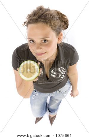 Young Woman With Half Of A Grejpfrut