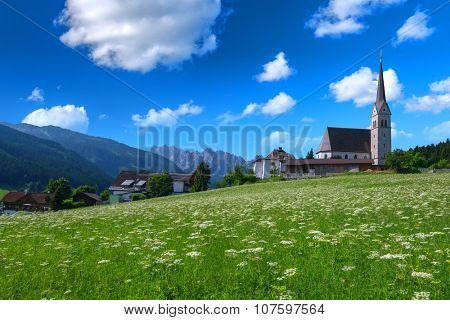 Christianity churh in Gosau village at sunny day. Alps, Austria, Europe.