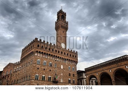Palazzo Vecchio in Florence, Italy on a cloudy day. Dramatic sky in Italian Firenze