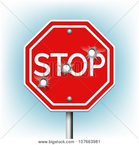 Stop sign with bullet holes