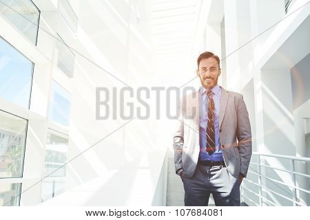 Young happy intelligent lawyer posing with copy space area for text