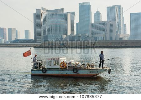 Unidentified Two Worker Are Cleaning Up By Picking  Trashes From The Haige Sea Around  Tianjin The B