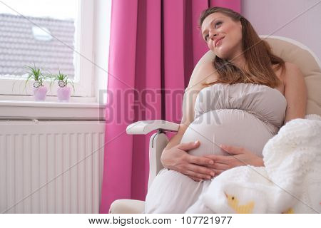 Pregnant Woman In A Chair