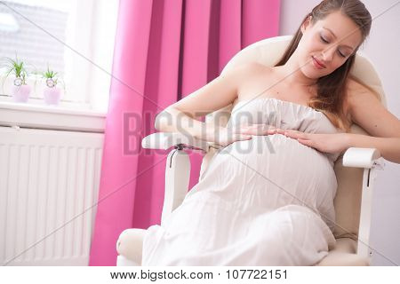 Pregnant Woman In A Chair