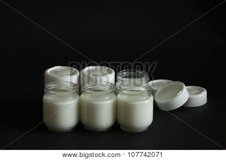 Six jars with milk