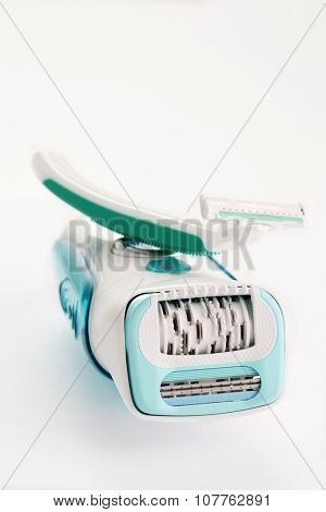 depilator and razor on white - beauty treatment