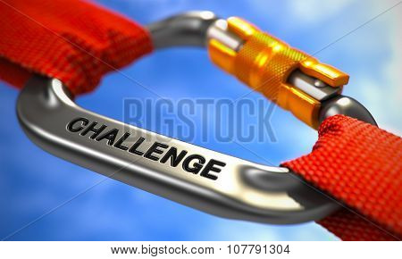 Challenge on Chrome Carabiner between Red Ropes.