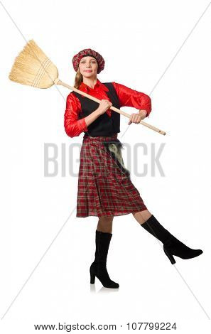 Funny woman in scottish clothing with broom