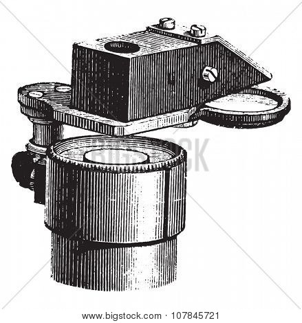Lucida Mr. Nachet adopted under the microscope, vintage engraved illustration. Industrial encyclopedia E.-O. Lami - 1875.