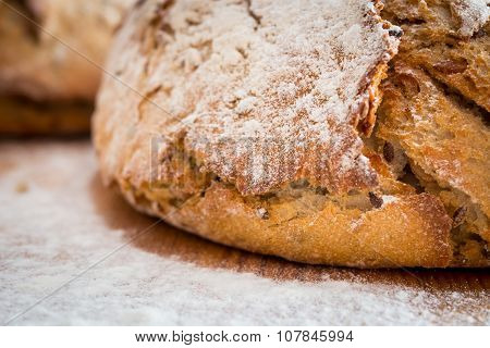 Bread and flour on the wooden table